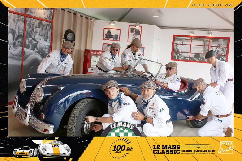 A joint photo of stylishly dressed friends from the Fordever club on a trip to Le Mans Classic 2023
